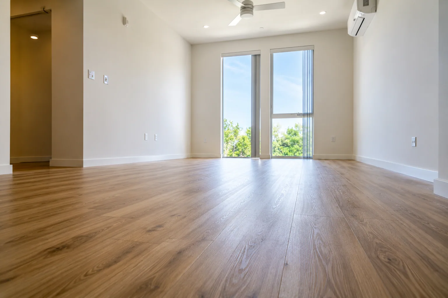 Freshly finished hardwood-look LVT flooring in a bright commercial interior